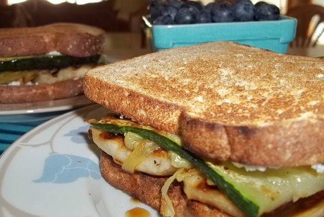 Sandwich of grilled zucchini and eggplant, roasted green chiles and Green Goat Dairy herbed chevre on whole grain bread